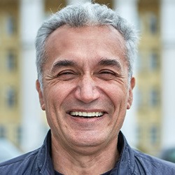 A smiling middle-aged man