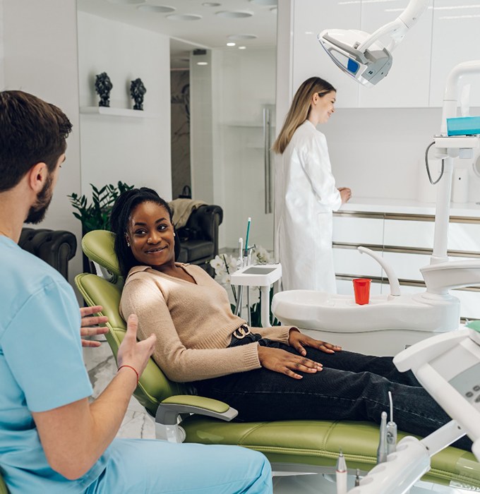 a woman speaking with her dentist