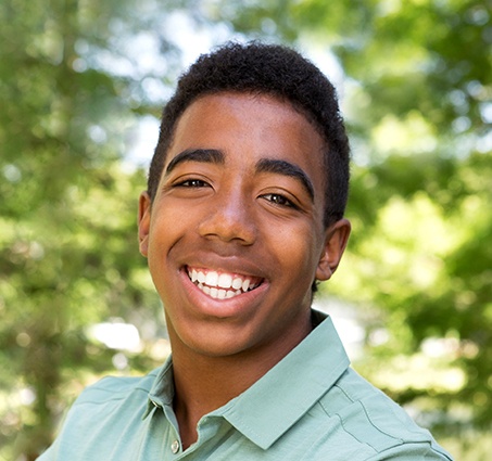 Young man sharing healthy smile after restorative dentistry