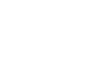 Icon of a person sitting at a desk with a computer