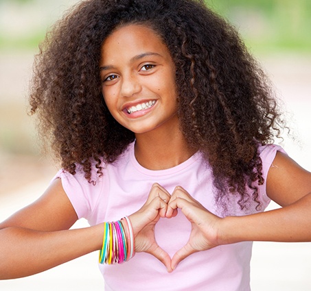 Young girl smiling after children's dentistry visit