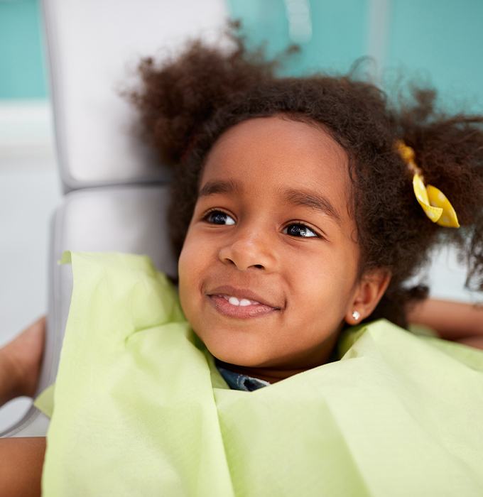 Little girl smiling after receiving dental sealants