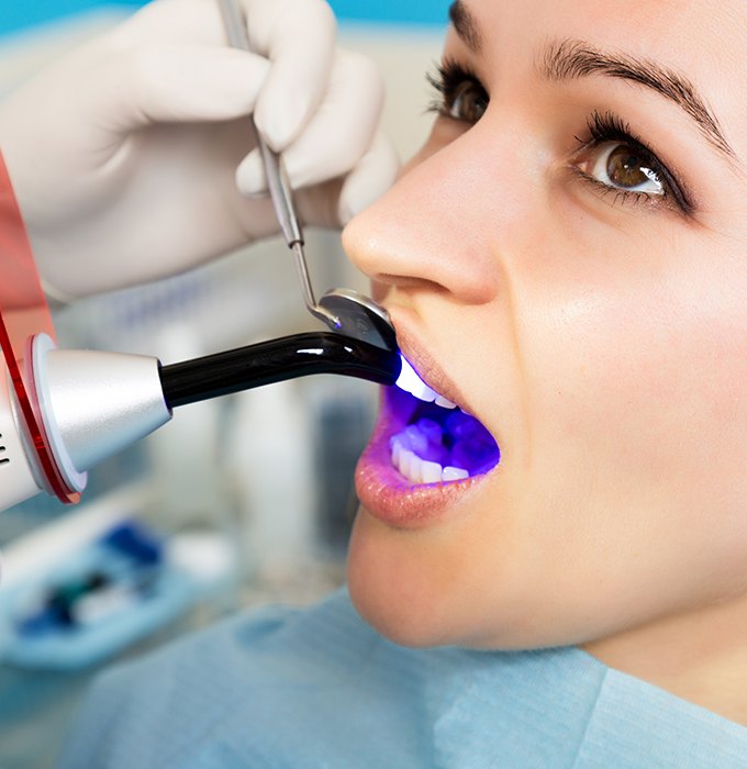 Patient receiving dental bonding treatment