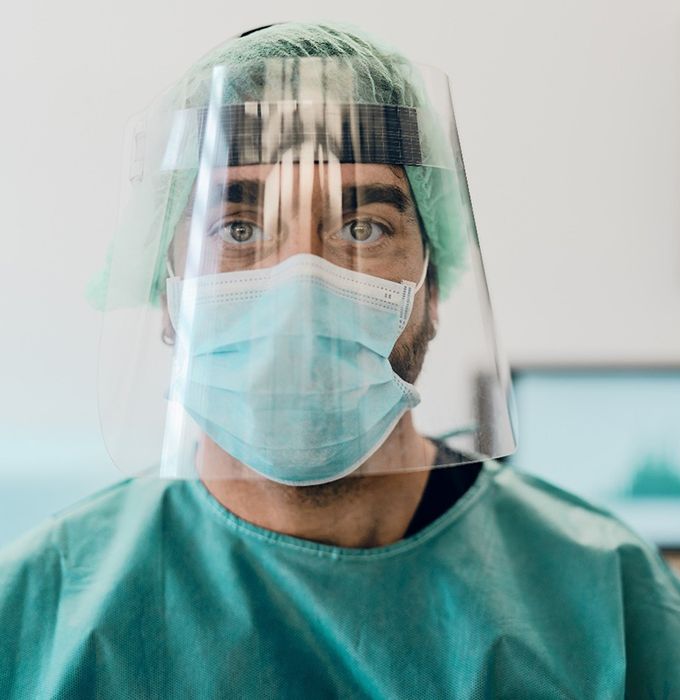 an emergency dentist with PPE on