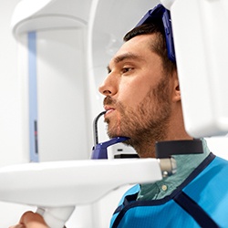 dentist with a dental implant digitally edited in their hands 