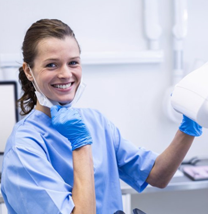 Smiling dental team member in a treatment room