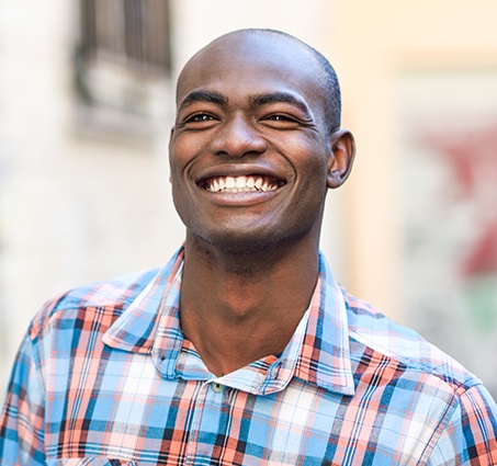 Man with healthy smile after gum disease treatment