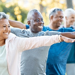 Adults smiling in workout class