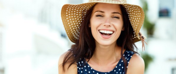 Woman with perfectly aligned smile after orthodontic treatment