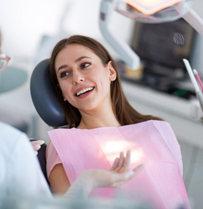 Woman smiling in the dental chair