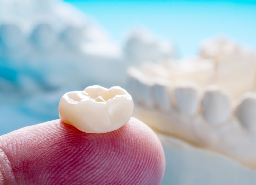 Dental crown on fingertip